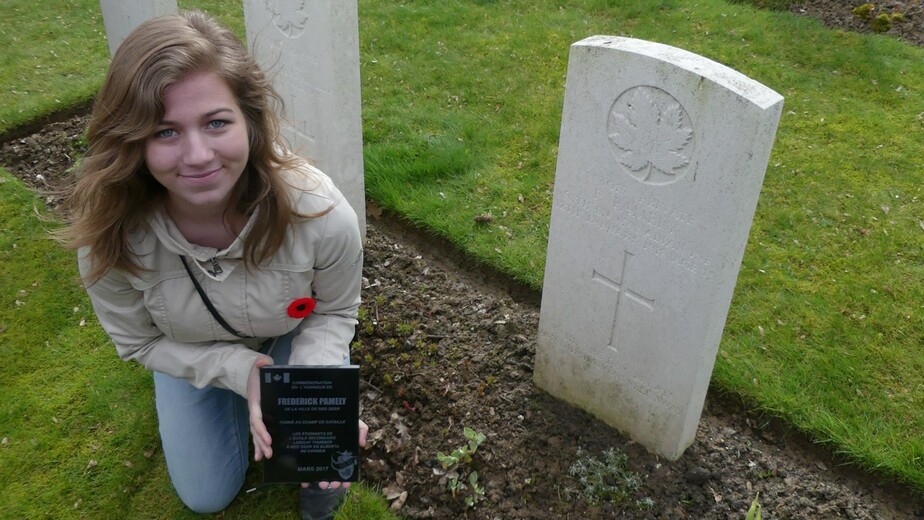 student at grave stone