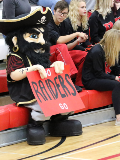 Bucky mascot with Go Raiders Go sign